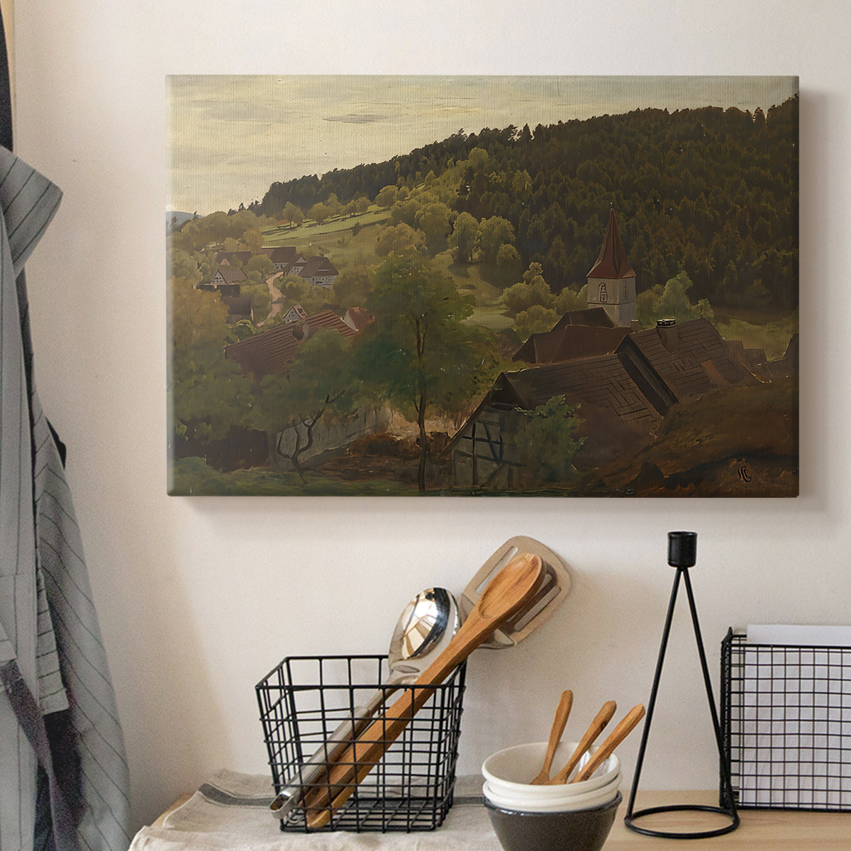 Canvas art print detailing a romantic landscape with depth and layered hills, displayed in a softly lit workspace setting