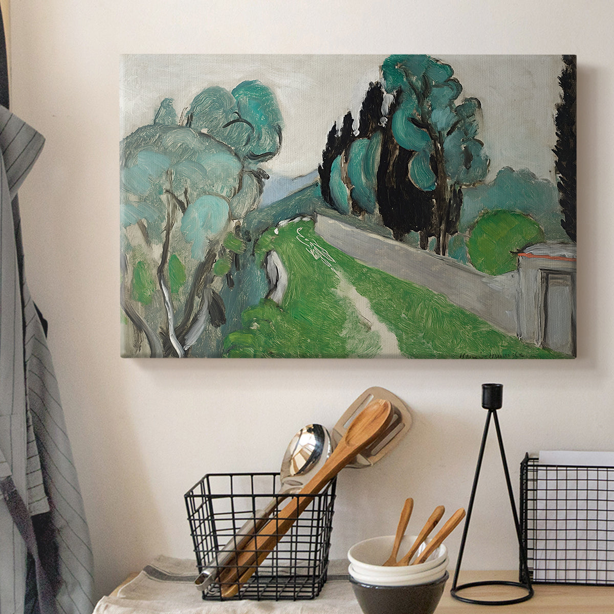Canvas art print detailing a bright natural view with cypress and olive trees, displayed in a softly lit workspace setting