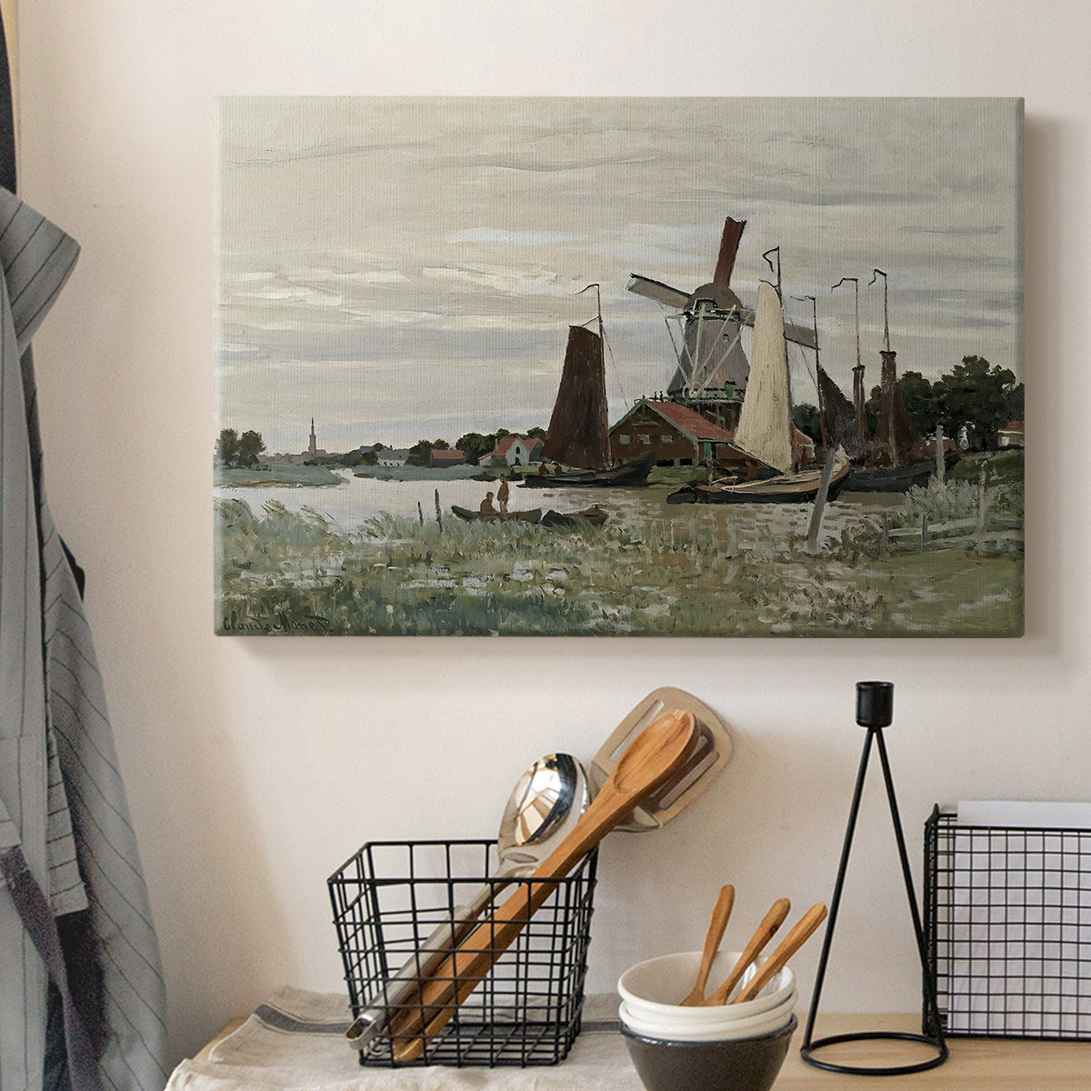 Canvas art print detailing a countryside structure standing against open sky, displayed in a softly lit workspace setting