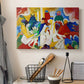 Canvas art print detailing a layered composition with bold color contrasts and movement, displayed in a softly lit workspace setting