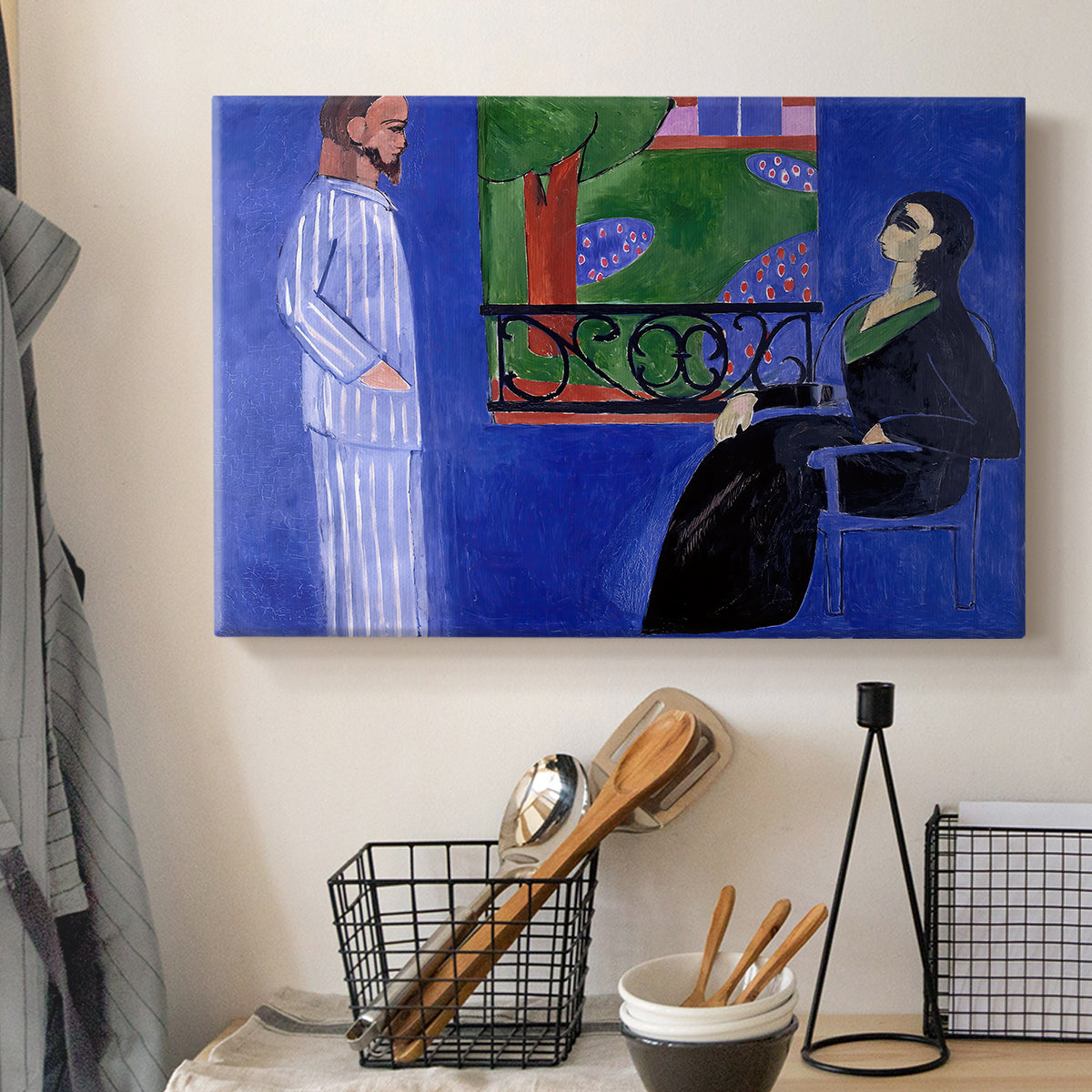 Canvas art print detailing a bold composition of two figures in a room, displayed in a softly lit workspace setting