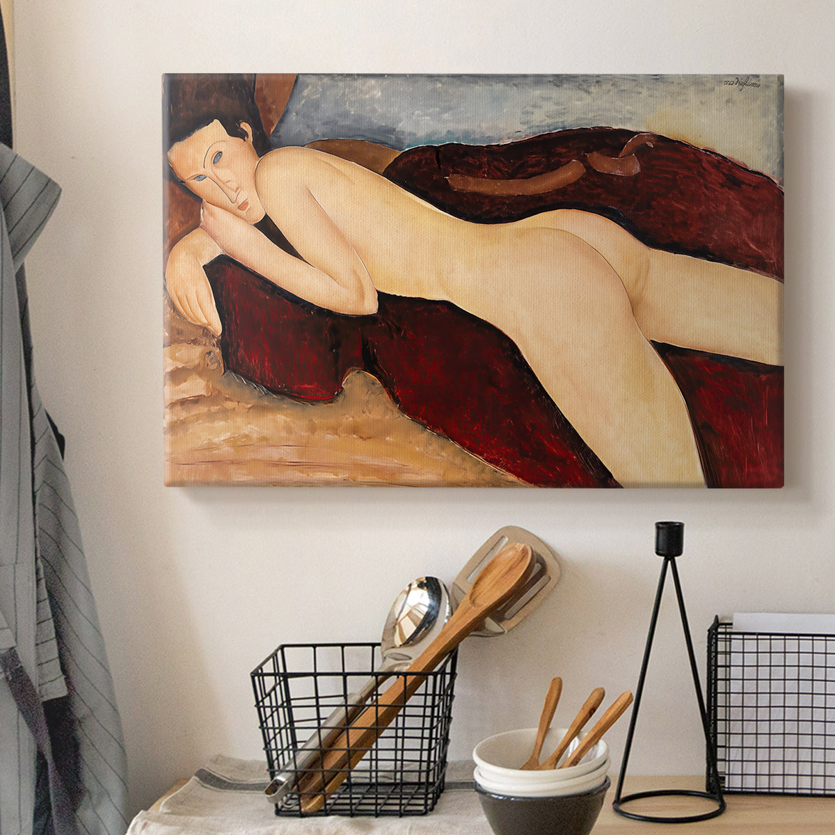 Canvas art print detailing a stylized depiction of woman's back and form in reclining pose, displayed in a softly lit workspace setting