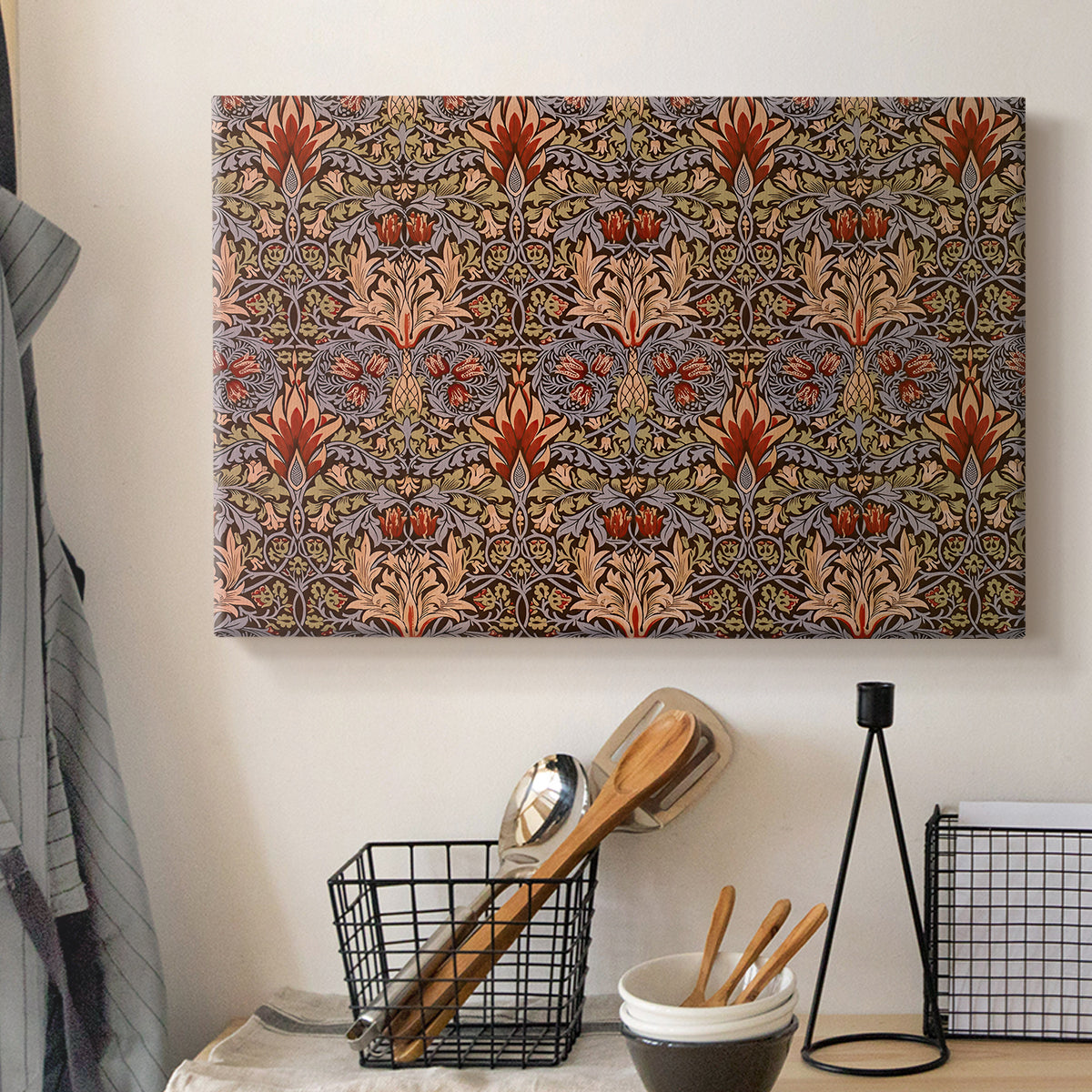 Canvas art print detailing a botanical motif arranged in structured repeat pattern, displayed in a softly lit workspace setting