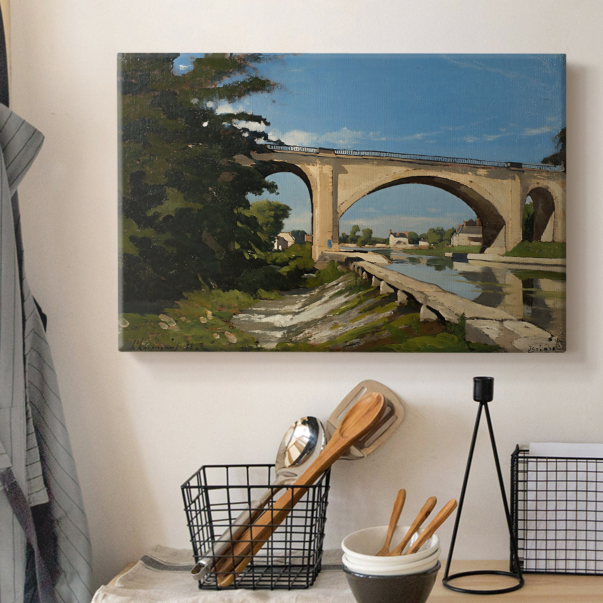 Canvas art print detailing an industrial structure integrated into natural landscape, displayed in a softly lit workspace setting