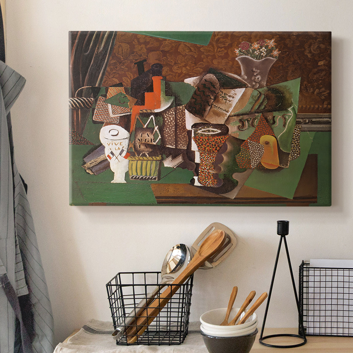 Canvas art print detailing an expressive collage of objects, displayed in a softly lit workspace setting