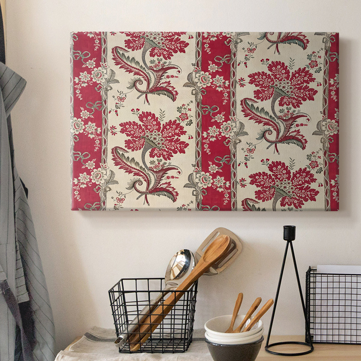 Canvas art print detailing a pattern with floral elements organized around curved central forms, displayed in a softly lit workspace setting