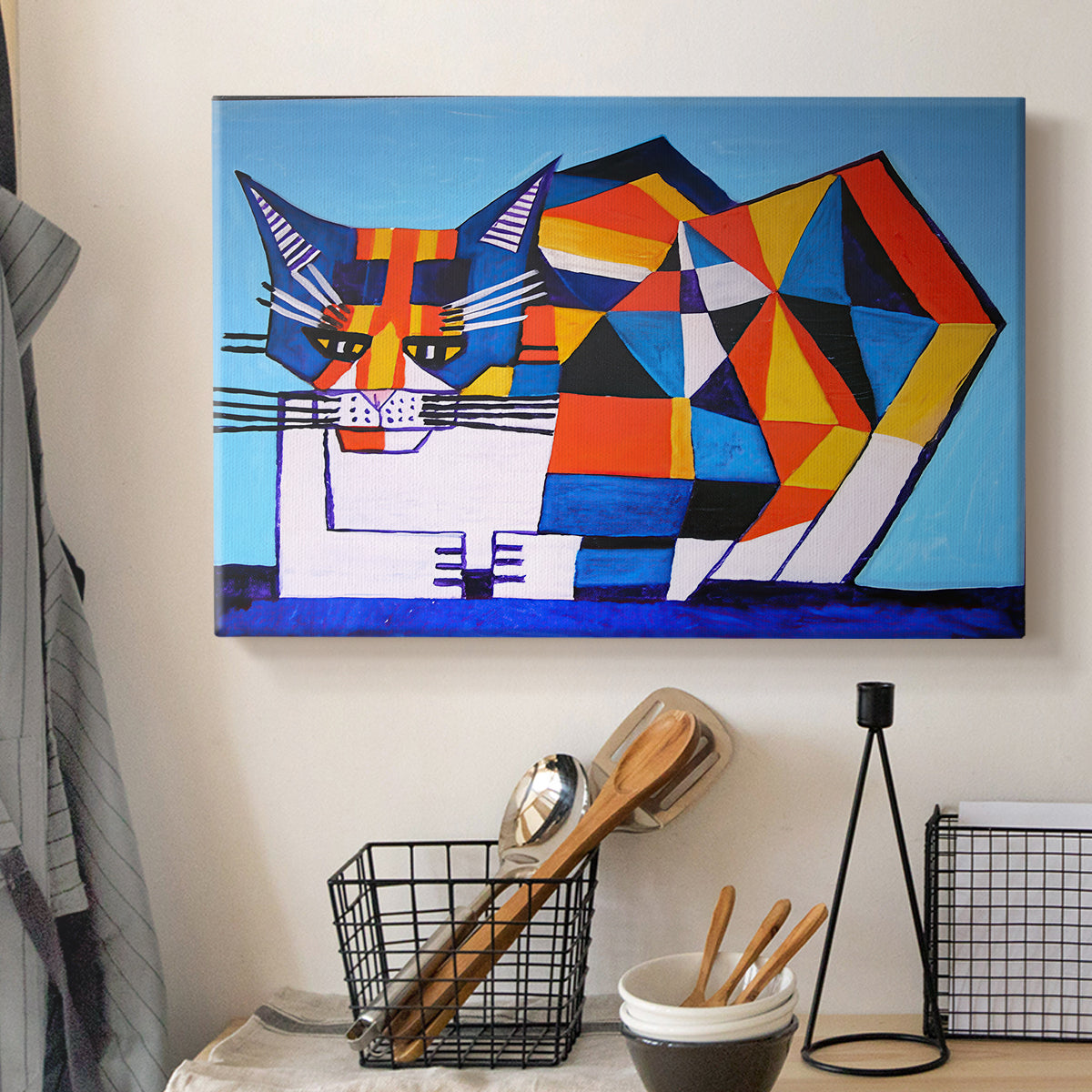 Canvas art print detailing an expressive design with color blocks, displayed in a softly lit workspace setting