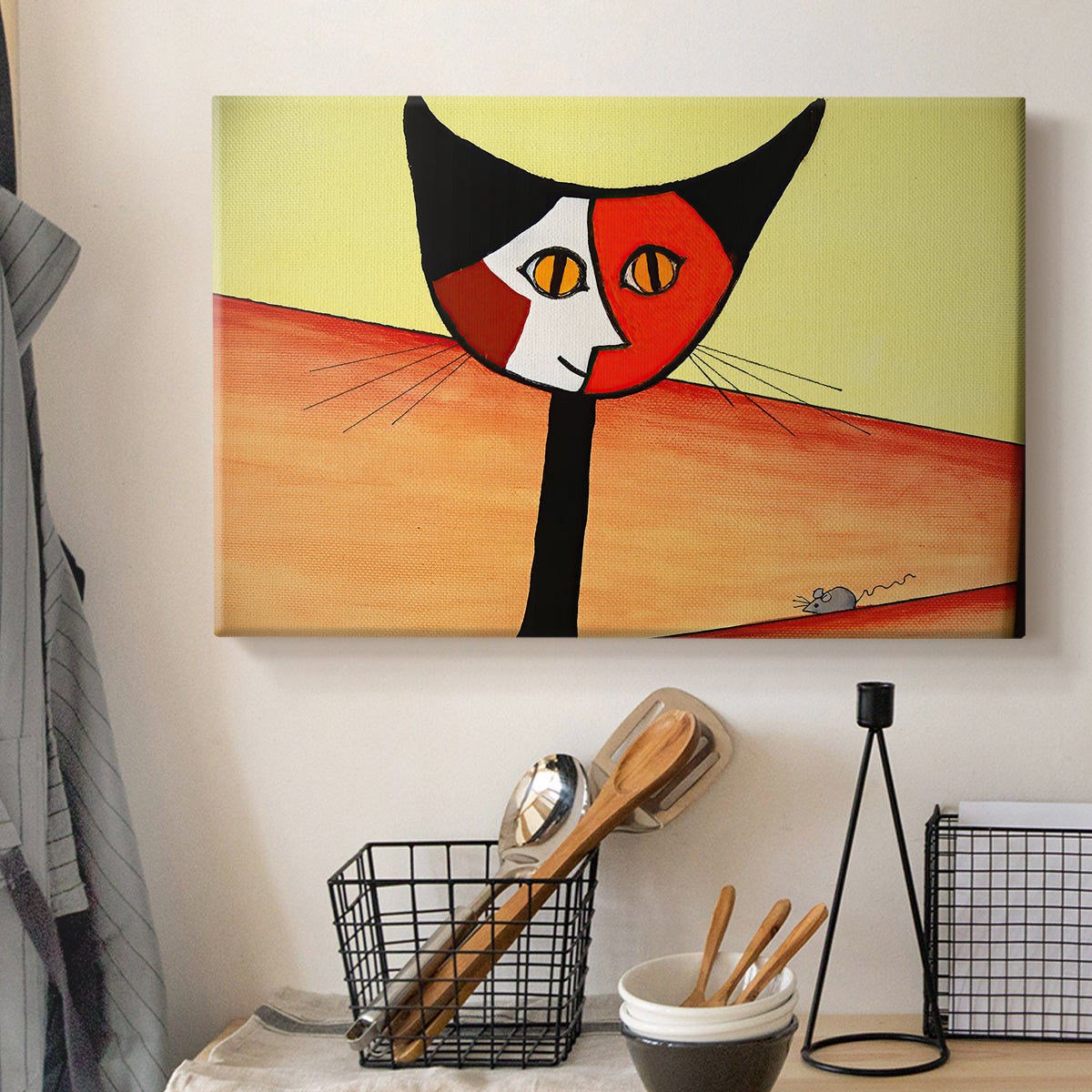 Canvas art print detailing a digital artwork of cat in geometric style, displayed in a softly lit workspace setting