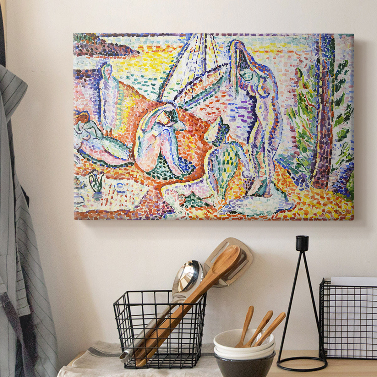 Canvas art print detailing a stylized outdoor composition of figures by the coast, displayed in a softly lit workspace setting
