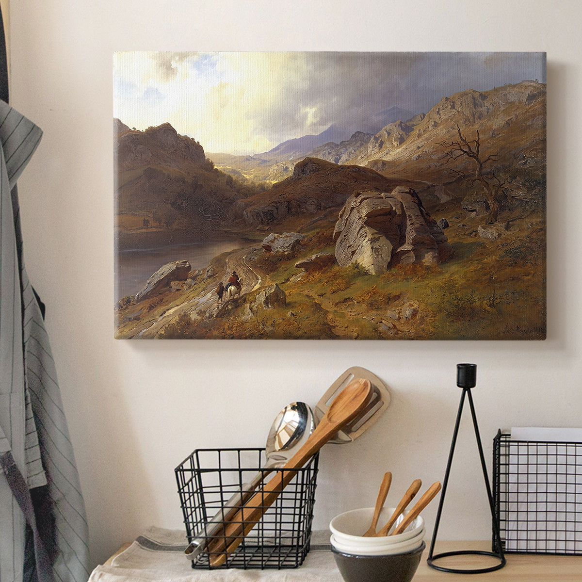 Canvas art print detailing a romantic landscape view with dramatic sky and valley, displayed in a softly lit workspace setting