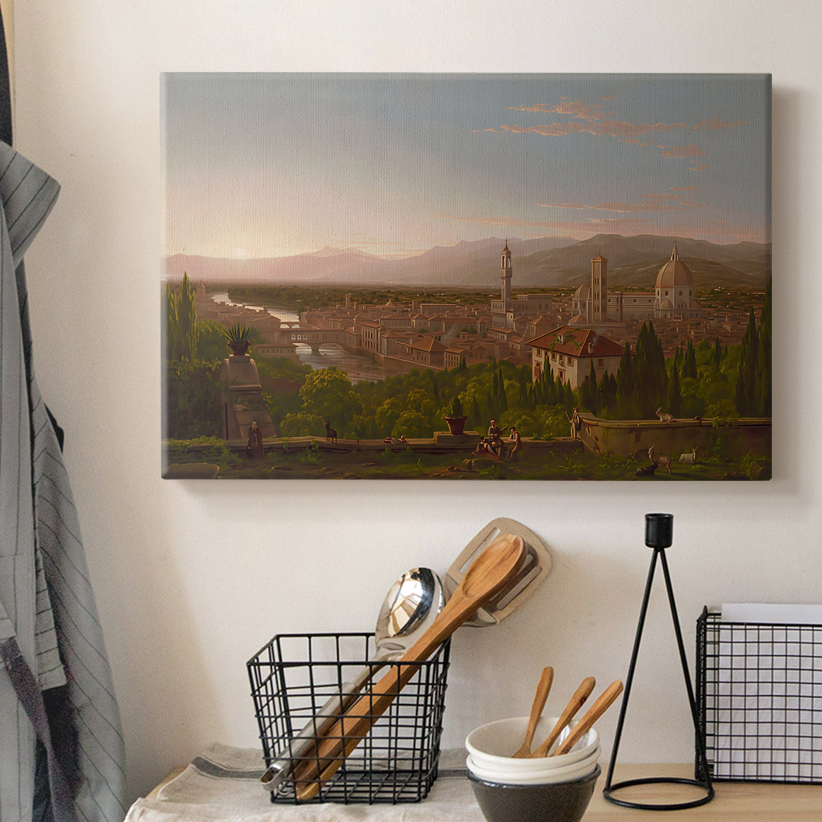 Canvas art print detailing an elevated view combining urban and countryside elements, displayed in a softly lit workspace setting