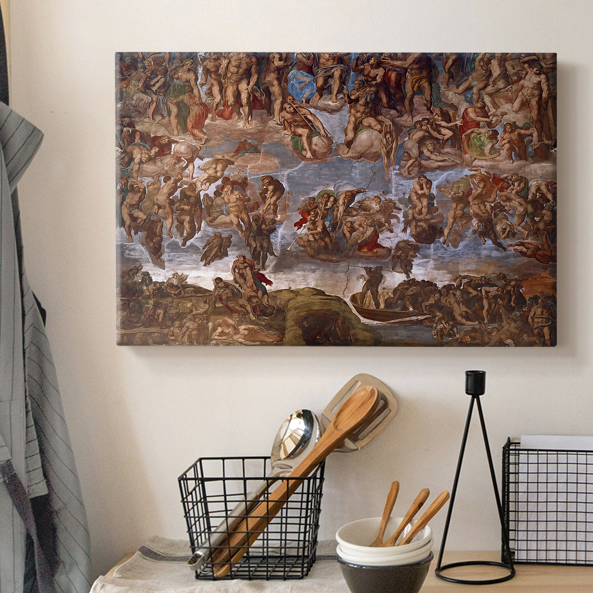 Canvas art print detailing a fresco scene showing turmoil, displayed in a softly lit workspace setting