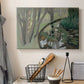 Canvas art print detailing a stylized landscape centered on water, displayed in a softly lit workspace setting