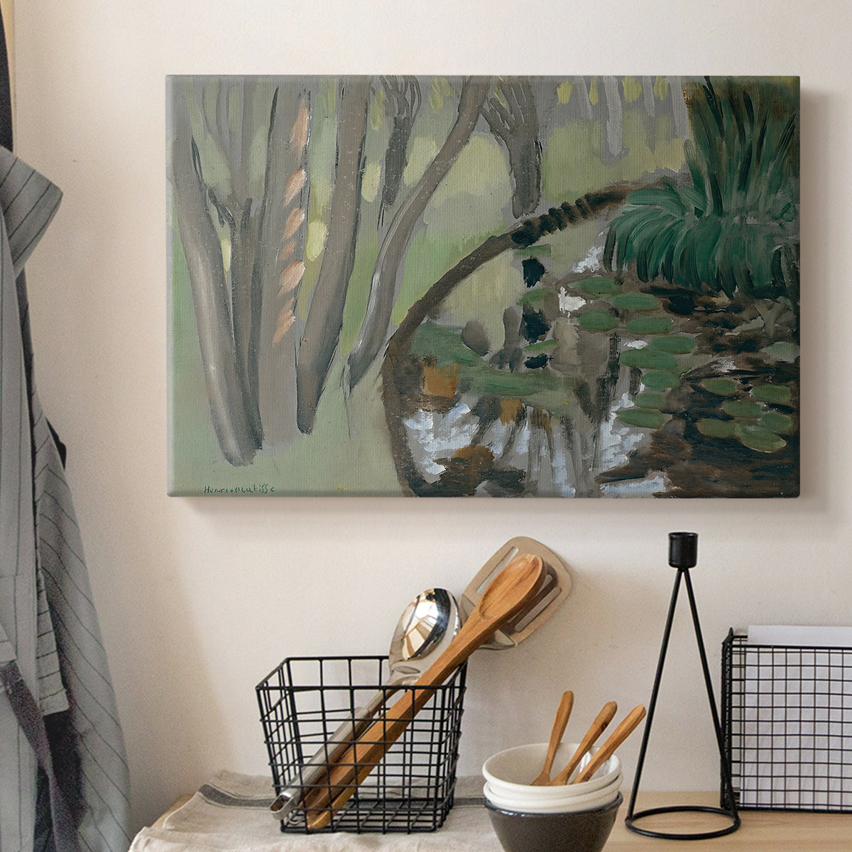Canvas art print detailing a stylized landscape centered on water, displayed in a softly lit workspace setting