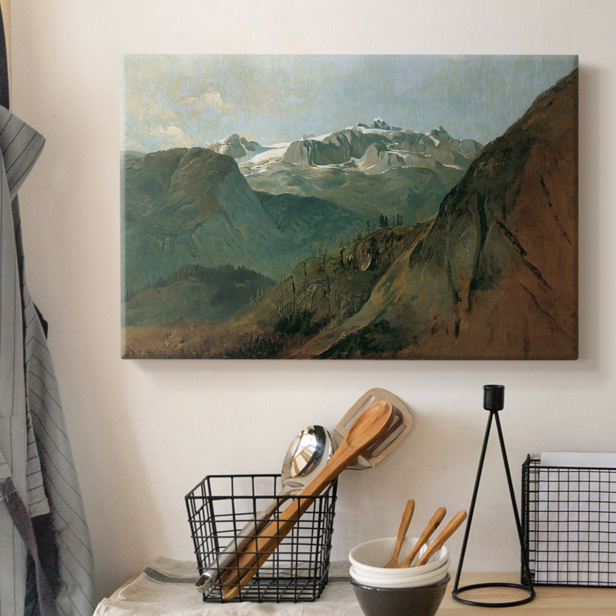 Canvas art print detailing a rugged terrain view, displayed in a softly lit workspace setting