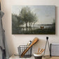 Canvas art print detailing an atmospheric natural setting with marsh and soft sky, displayed in a softly lit workspace setting