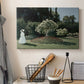 Canvas art print detailing a tranquil garden portrait with soft natural light, displayed in a softly lit workspace setting
