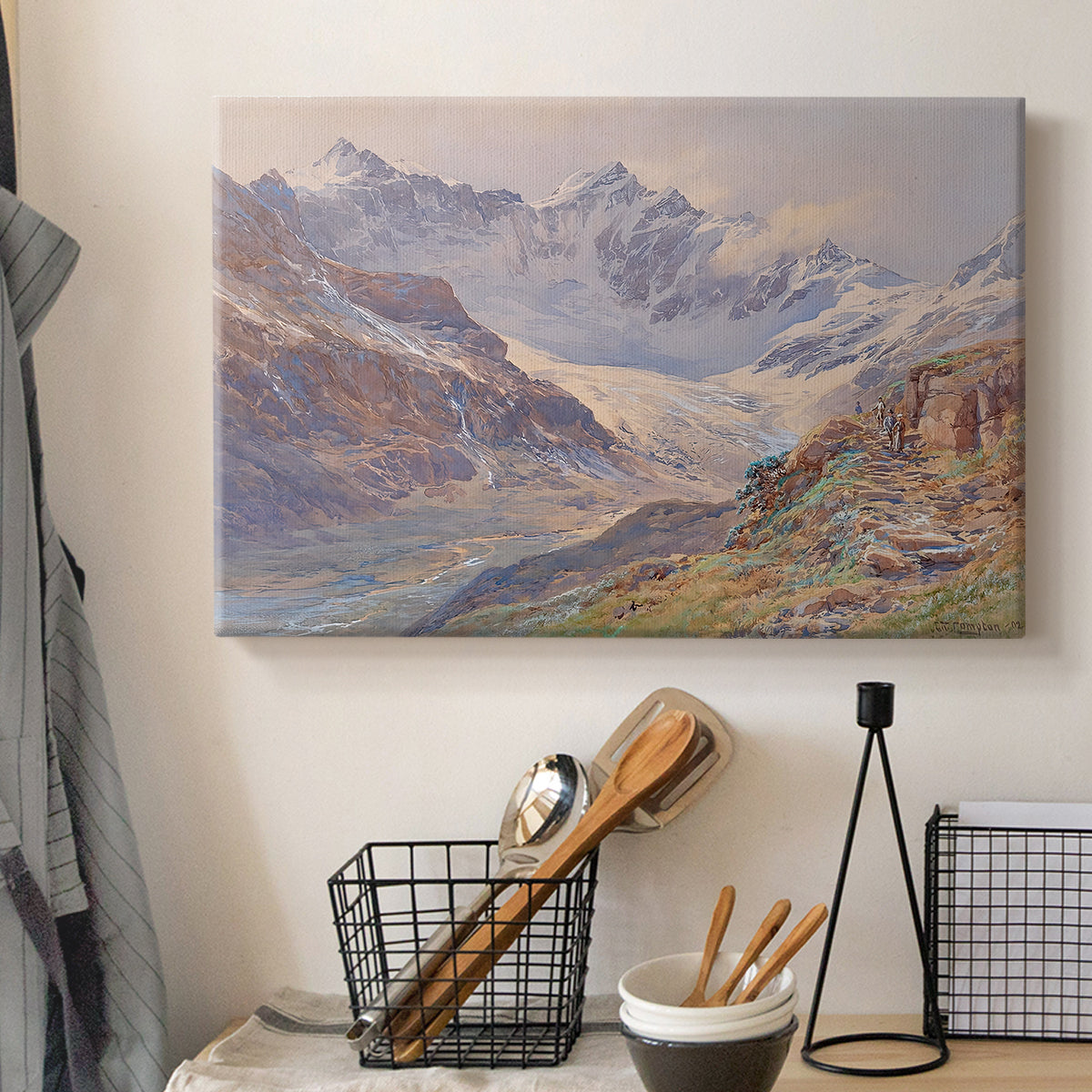 Canvas art print detailing an expansive alpine view with ice and distant mountains, displayed in a softly lit workspace setting