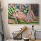 Canvas art print detailing a stylized odalisque in a richly ornamented interior, displayed in a softly lit workspace setting