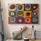 Canvas art print detailing an abstract design focused on color interaction and repetition, displayed in a softly lit workspace setting