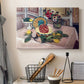 Canvas art print detailing a stylized composition centered on pineapple and lemons, displayed in a softly lit workspace setting