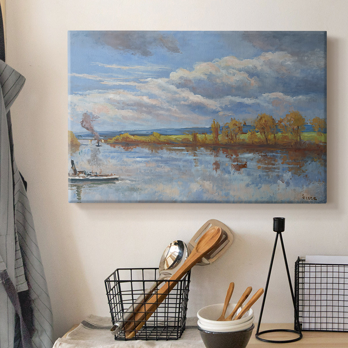 Canvas art print detailing a tranquil composition with riverbank, displayed in a softly lit workspace setting