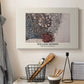 Canvas art print detailing a repeating vine motif with flowers and curved leaf forms, displayed in a softly lit workspace setting