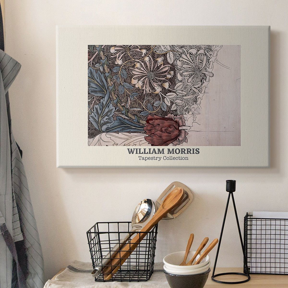Canvas art print detailing a repeating vine motif with flowers and curved leaf forms, displayed in a softly lit workspace setting