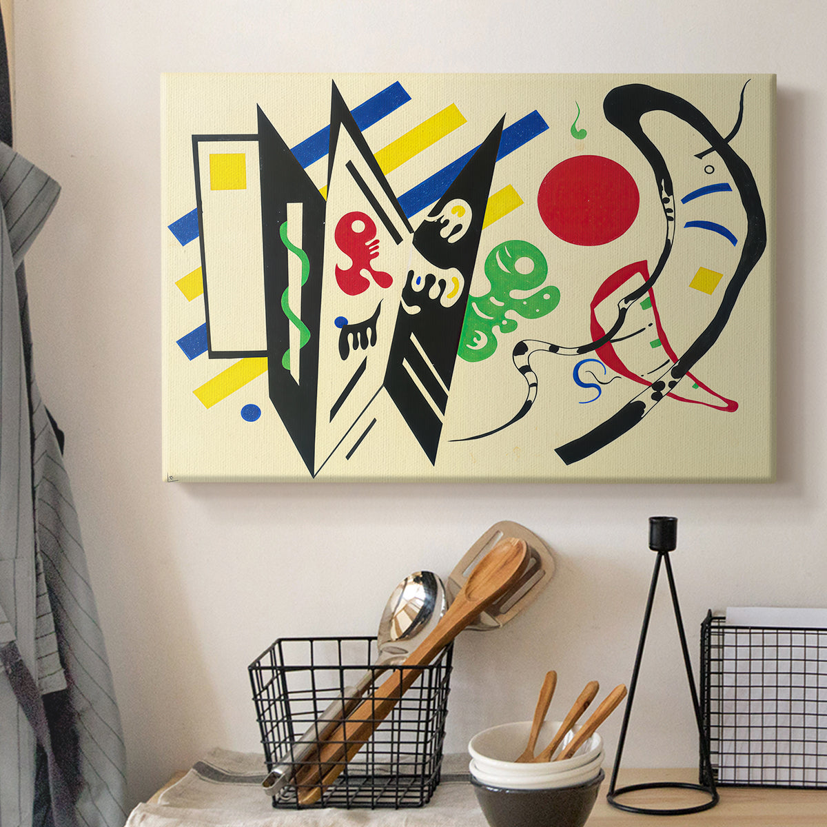 Canvas art print detailing a stylized composition with shapes and directional movement, displayed in a softly lit workspace setting