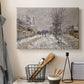 Canvas art print detailing an urban winter landscape with muted tones and soft light, displayed in a softly lit workspace setting