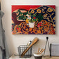 Canvas art print detailing a stylized composition of fruit and tableware, displayed in a softly lit workspace setting