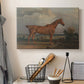 Canvas art print detailing a countryside composition with horse and rider, displayed in a softly lit workspace setting