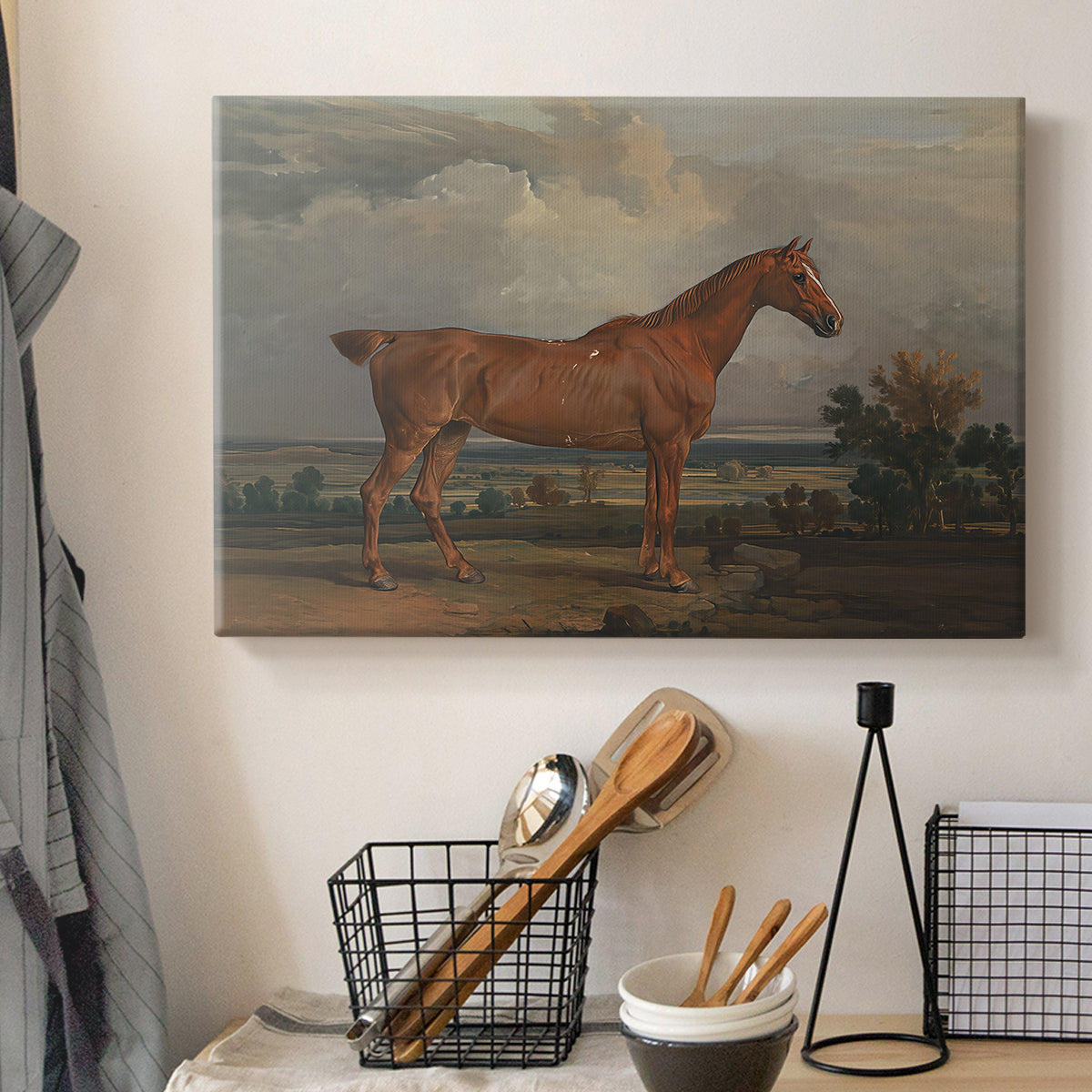 Canvas art print detailing a countryside composition with horse and rider, displayed in a softly lit workspace setting