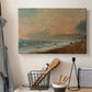 Canvas art print detailing a natural beach landscape with soft movement, displayed in a softly lit workspace setting