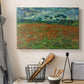 Canvas art print detailing an open field composition with low horizon and vegetation, displayed in a softly lit workspace setting