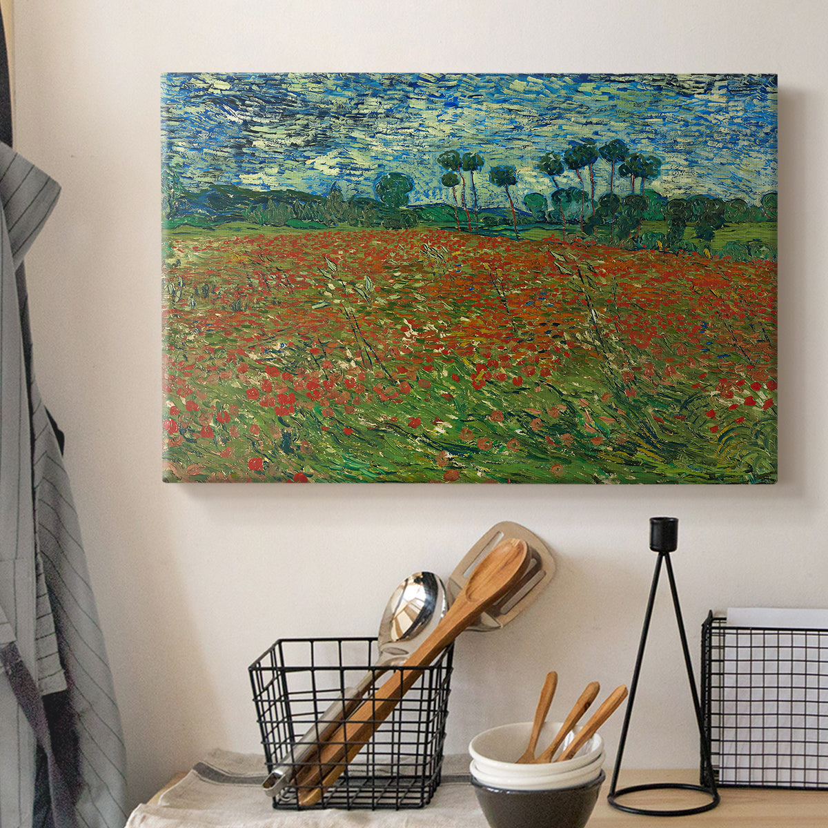 Canvas art print detailing an open field composition with low horizon and vegetation, displayed in a softly lit workspace setting