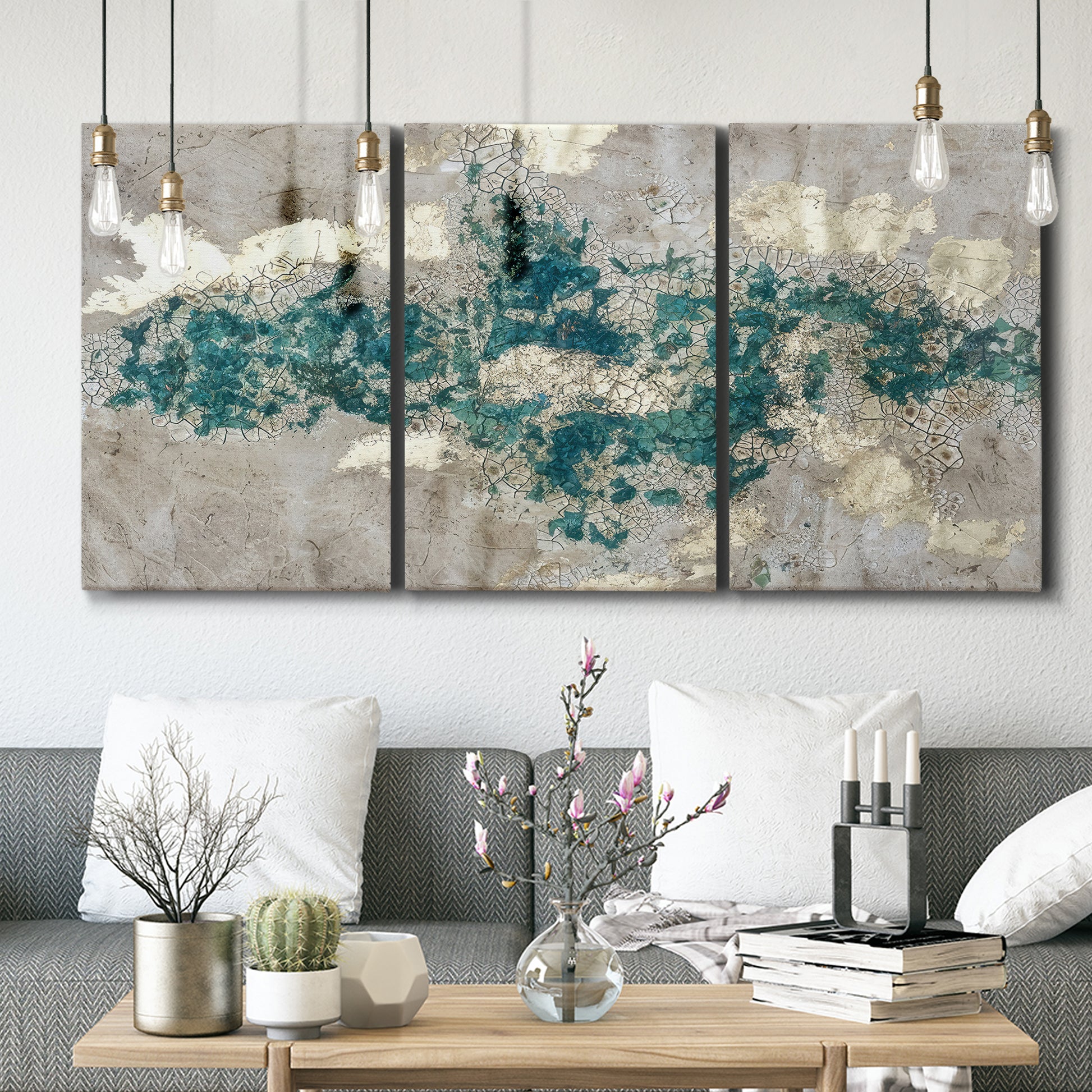 Three-panel canvas wall art featuring layered mineral abstract textures, displayed in a modern living room above seating.