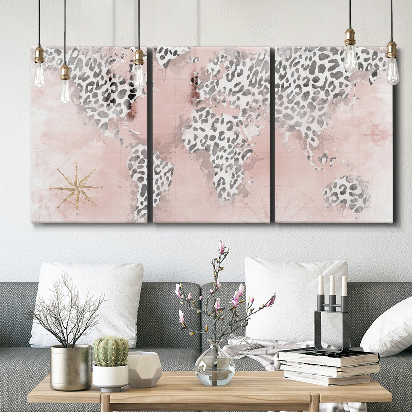 Three-panel canvas wall art featuring stylized pink cheetah world map, displayed in a modern living room above seating.