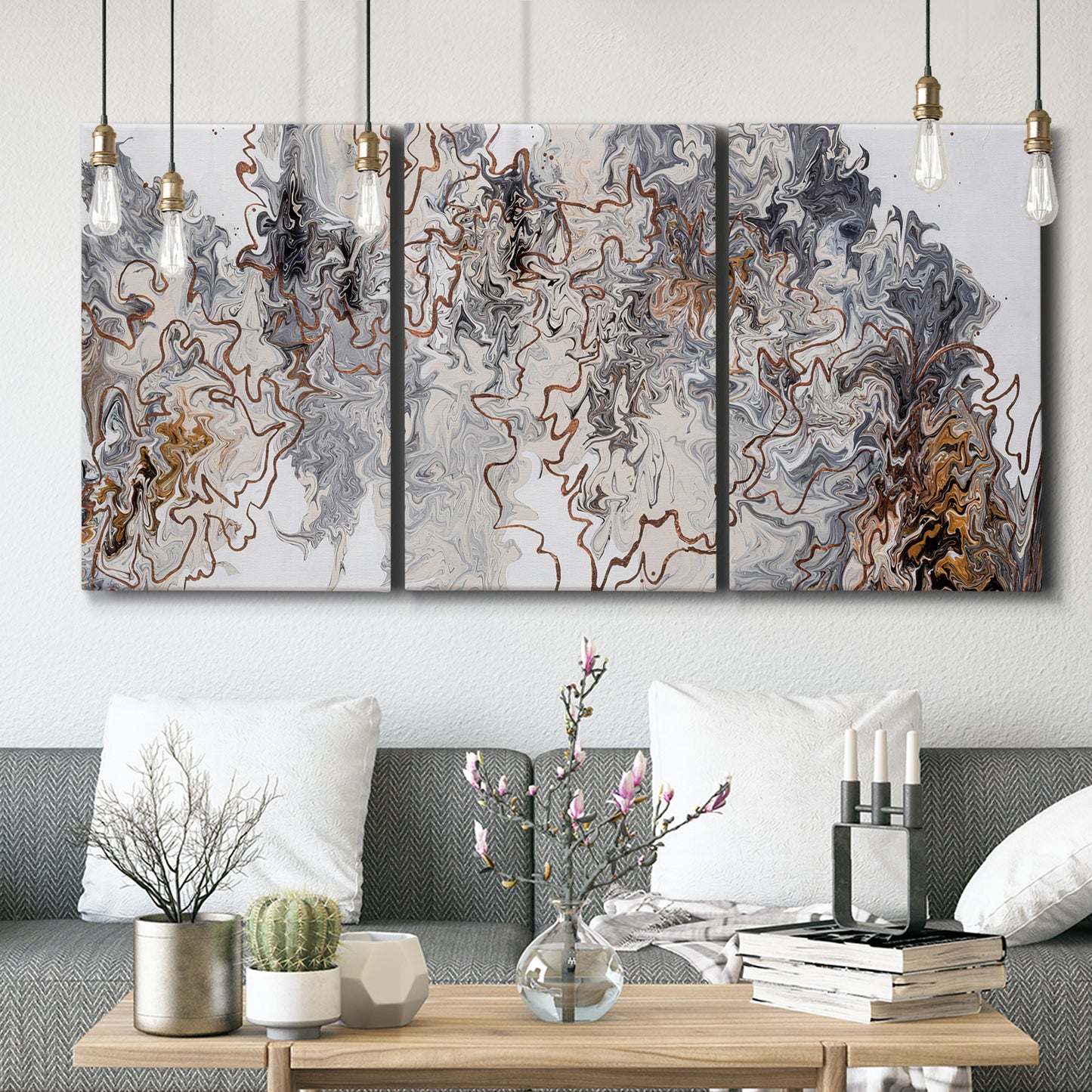 Three-panel canvas wall art featuring wooded trail through forest, displayed in a modern living room above seating.