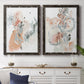 Set of two black barnwood framed canvas prints depicting a coordinated art pair of loose blush gray and coral floral gestures rendered as abstract watercolor botanicals above a dining room sideboard.