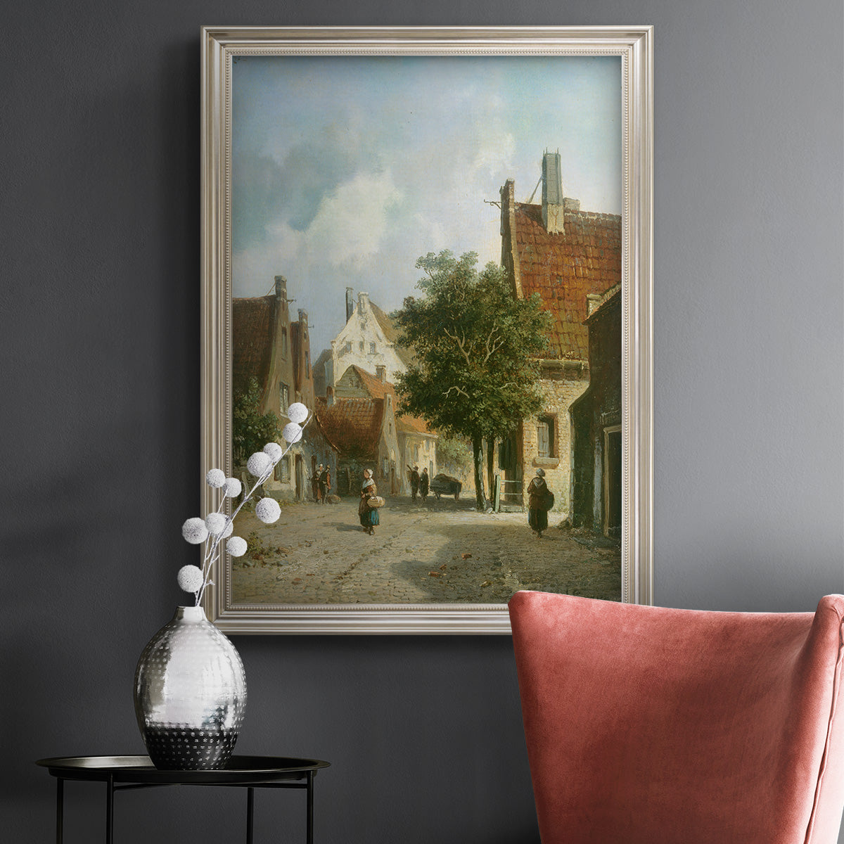 Rustic European street scene painting by Adriaan Eversen in an ornate champagne frame displayed in a dark-toned interior setting.