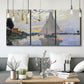 Three-panel canvas wall art featuring riverside village shoreline, displayed in a modern living room above seating.