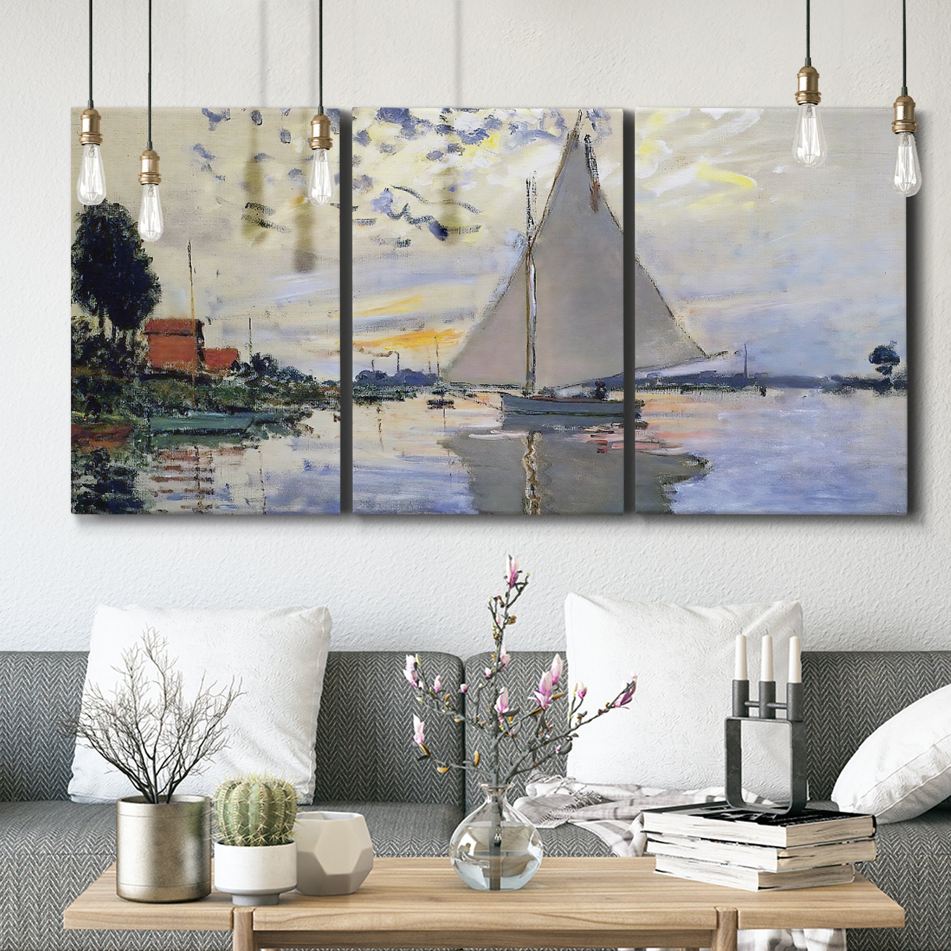 Three-panel canvas wall art featuring riverside village shoreline, displayed in a modern living room above seating.