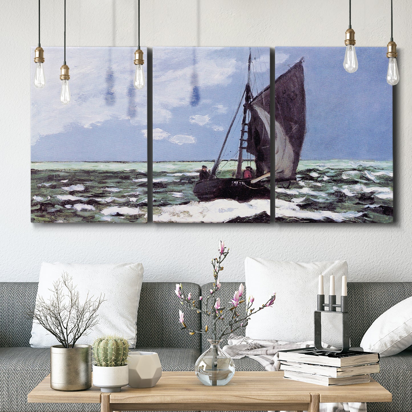 Three-panel canvas wall art featuring stormy sea with crashing waves, displayed in a modern living room above seating.
