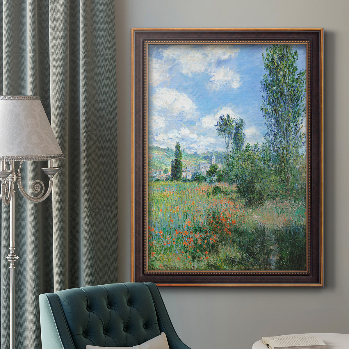 Impressionist pastoral landscape with poppy fields by Claude Monet in an ornate bronzed mahogany wood frame displayed in a dark-toned interior setting.