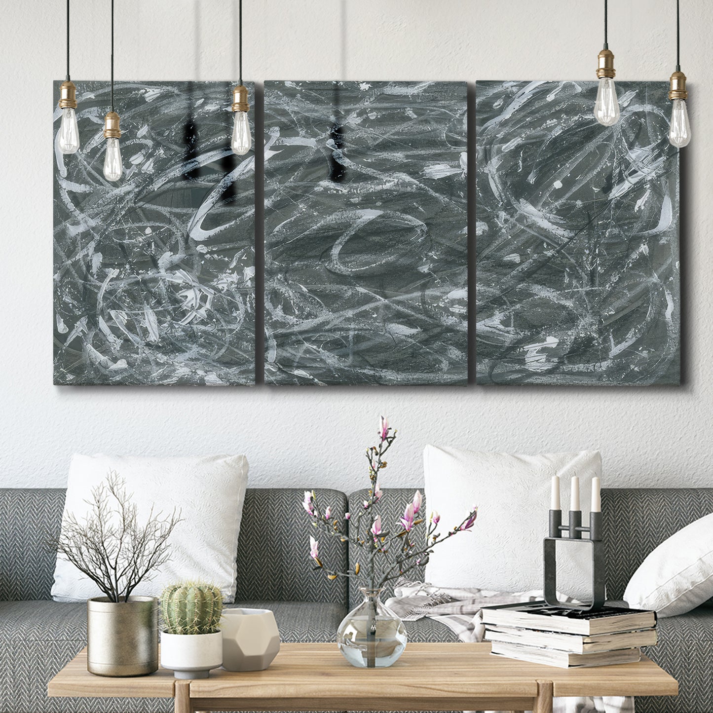 Three-panel canvas wall art featuring abstract view through window forms, displayed in a modern living room above seating.