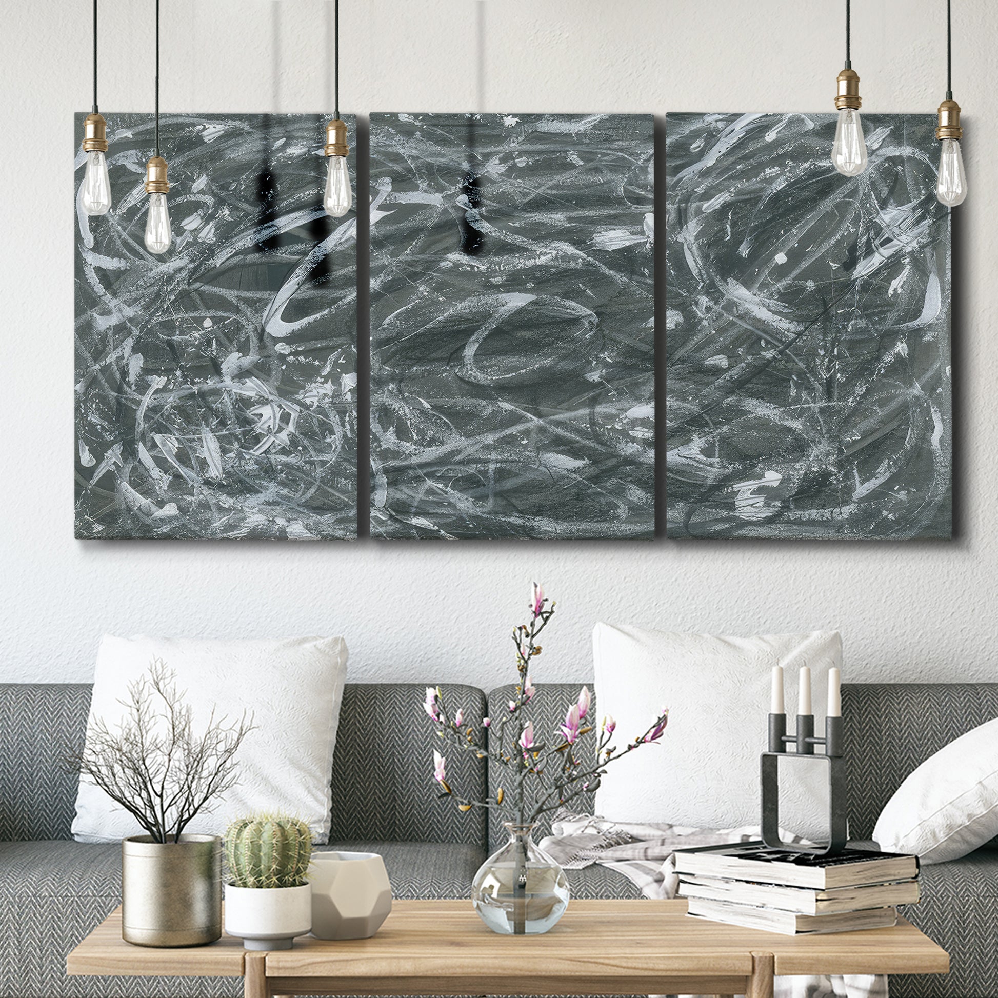 Three-panel canvas wall art featuring abstract view through window forms, displayed in a modern living room above seating.
