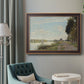 Impressionist river scene with red boats by Claude Monet in an ornate bronzed mahogany wood frame displayed in a bright interior setting.
