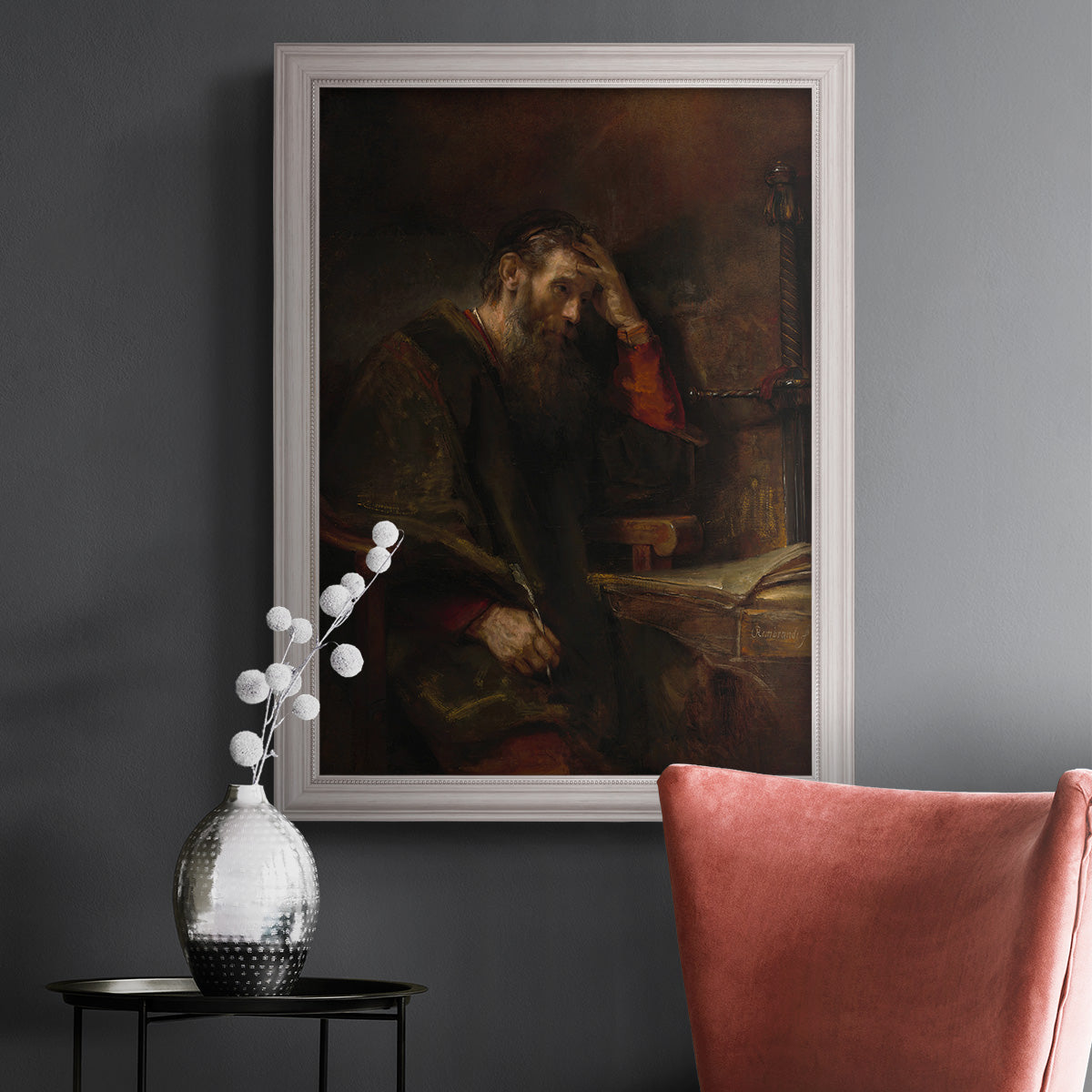 Classical religious portrait of Paul the Apostle by Rembrandt van Rijn in an ornate weathered white frame displayed in a dark-toned interior setting.