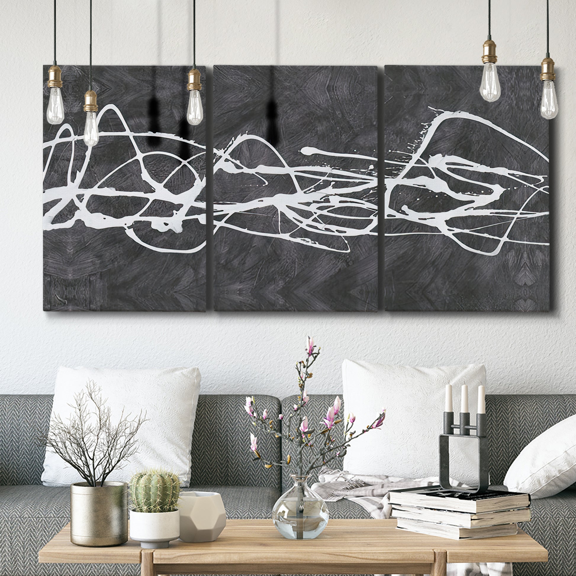 Three-panel canvas wall art featuring minimal abstract frequency lines, displayed in a modern living room above seating.